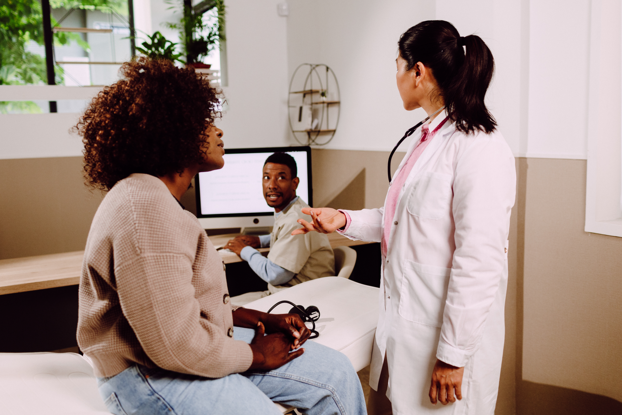Woman getting a check-up from her doctor